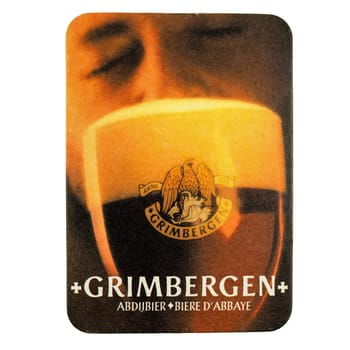 BRUSSELS, BELGIUM - MARCH 15, 2015: Beermat of Belgian beer Grimbergen isolated over white background