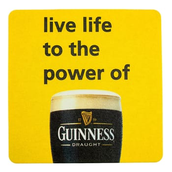 DUBLIN, IRELAND - MARCH 15, 2015: Beermat of Irish beer Guinness isolated over white background
