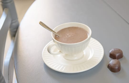 cup of hot chocolate with chocolate candy