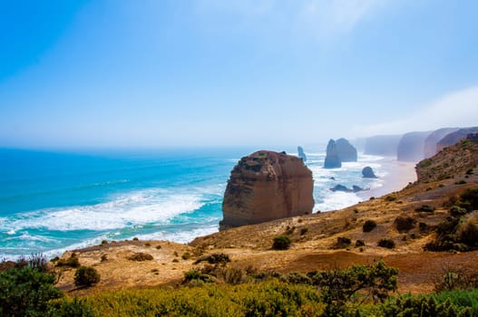 The Twelve Apostles, a famous collection of limestone stacks off the shore of the Port Campbell National Park, by the Great Ocean Road in Victoria, Australia