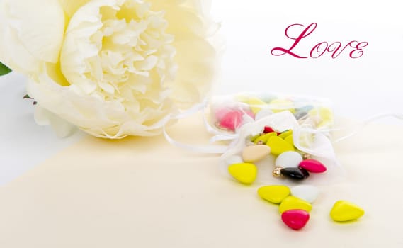Candy with a white flower laid on a table