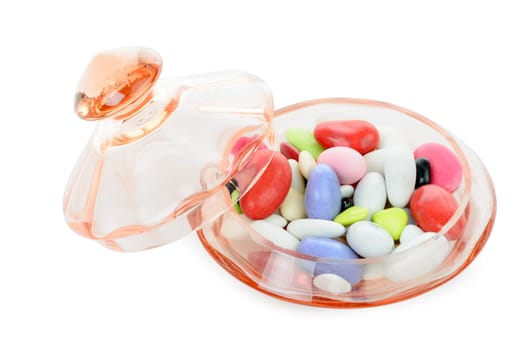 drages in a candy box on the white background