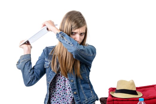 angry teenager with a digital tablet
