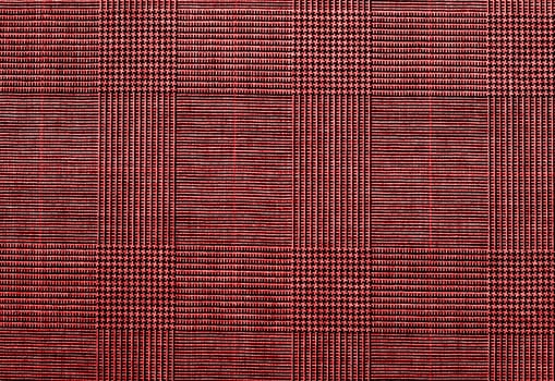 red background of textile texture. close up