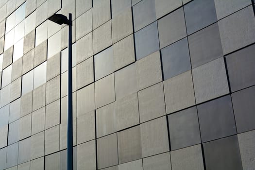 Facade of a modern building with street lamp in Magdeburg