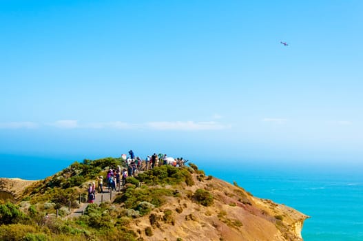 Port Campbell National Park, Victoria state, Australia - February 19, 2015: Tourists visiting the Twelve Apostles, a famous collection of limestone stacks off the shore of the Port Campbell National Park, by the Great Ocean Road in Victoria, Australia