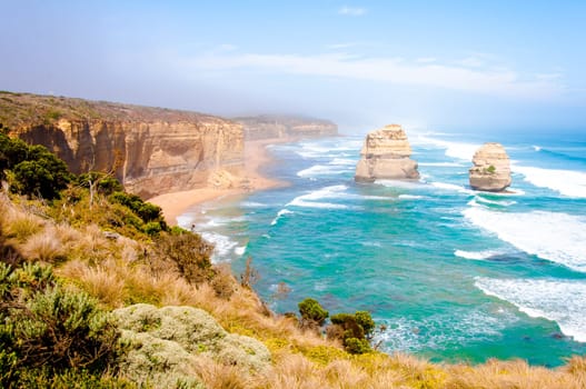 The Twelve Apostles, a famous collection of limestone stacks off the shore of the Port Campbell National Park, by the Great Ocean Road in Victoria, Australia