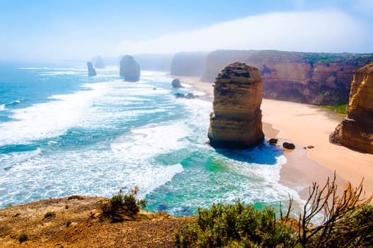 The Twelve Apostles, a famous collection of limestone stacks off the shore of the Port Campbell National Park, by the Great Ocean Road in Victoria, Australia