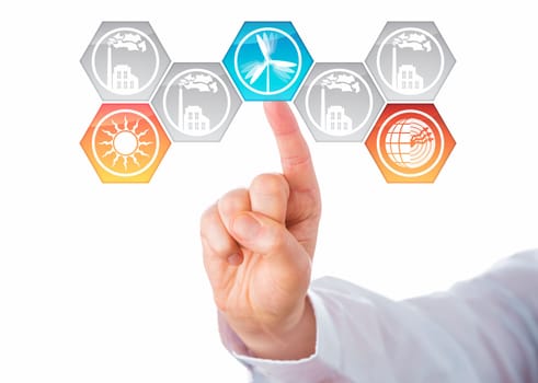 Solar, wind and geothermal power generation icons being chosen by the hand of a business man. Three activated hexagonal buttons lighting up in color, while factory symbols stay grey. Cutout on white.