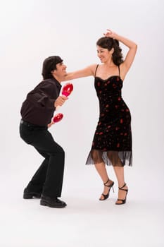 Studio portrait of couple dancing
