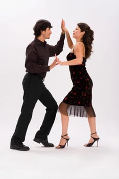 Studio portrait of couple dancing