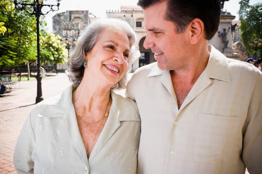 Close-up of a senior woman and her son looking at each other and smiling, Santo Domingo, Dominican Republic
