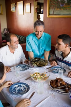 High angle view of a mature couple with their son and daughter sitting at a dining table