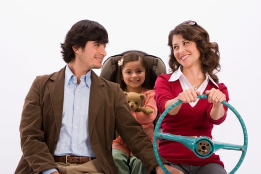 Studio portrait of happy family in imaginary car