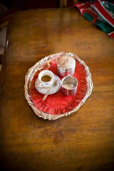 High angle view of a serving tray of espresso coffee on the dining table