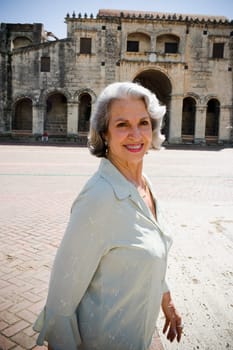 Portrait of a senior woman in front of a building, Santo Domingo, Dominican Republic