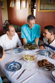 High angle view of a mature couple with their son and daughter sitting at a dining table