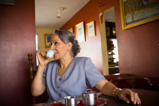 Close-up of a mature woman drinking tea