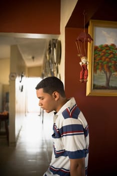 Side profile of a young man looking down