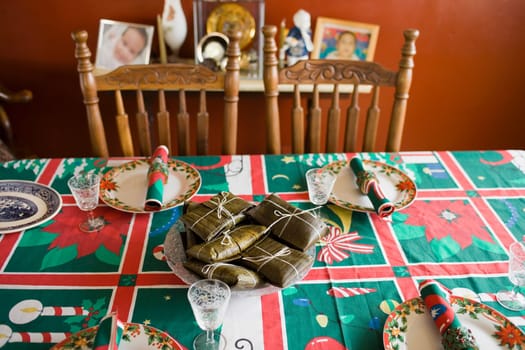 High angle view of pasteles wrapped in banana leaves on a plate