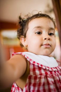 Close-up of a baby girl looking down