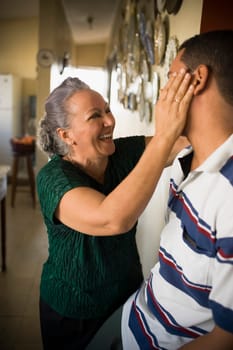 Close-up of a mature woman looking at her grandson and smiling