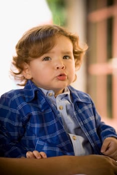 Close-up of a baby boy looking displeased