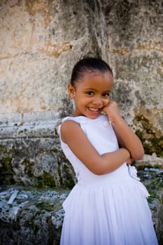 Portrait of a girl smiling with her hand on her chin, Santo Domingo, Dominican Republic