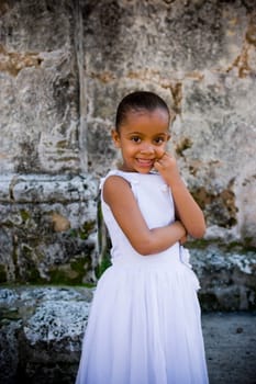 Portrait of a girl smiling with her hand on her chin, Santo Domingo, Dominican Republic