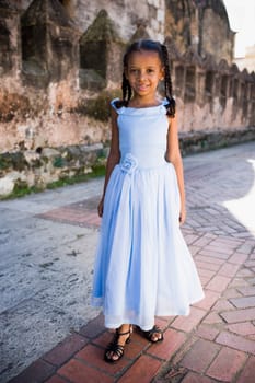 Portrait of a girl standing and smiling, Santo Domingo, Dominican Republic