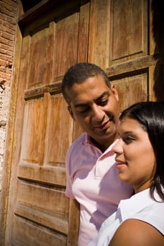 Side profile of a young woman with a mid adult man looking at her