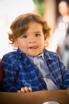 Close-up of a baby boy sticking out his tongue