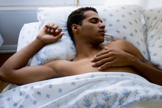High angle view of a young man sleeping