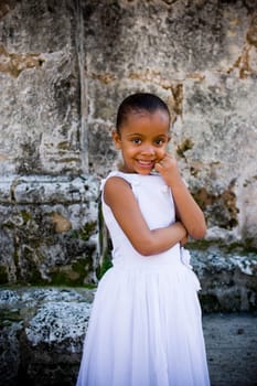 Portrait of a girl smiling with her hand on her chin, Santo Domingo, Dominican Republic