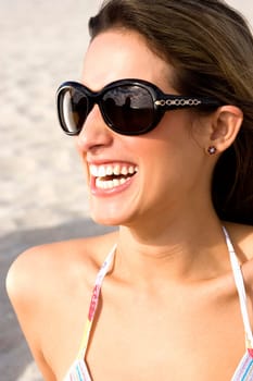 Close up portrait of young woman on beach