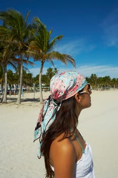 Young woman wearing bandana on beach