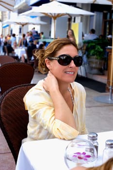 Woman at sidewalk cafe