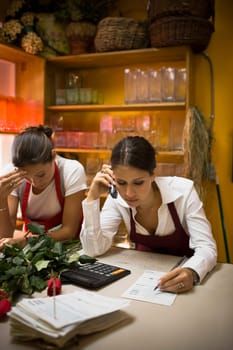 Two women working in flowers shop