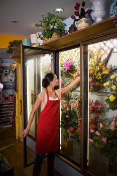 Young woman in her flower shop