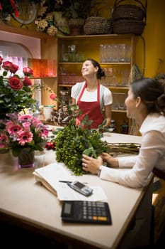 Two women working in flowers shop