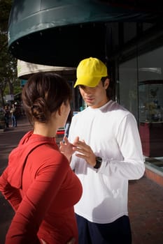 Young woman with physical trainer