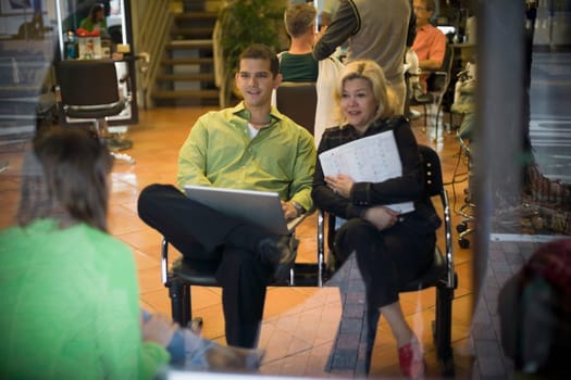 Salon owner discusses business with partner