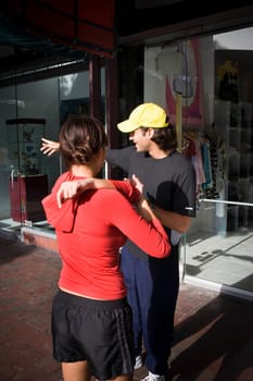 Young woman exercising with physical trainer