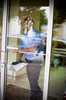 Cable man walking out of building outdoors