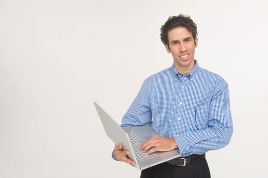 Young man holding laptop