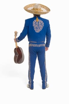 Portrait of Mariachi playing guitar and singing