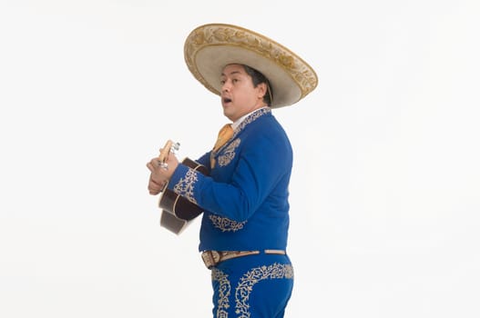 Portrait of Mariachi playing guitar and singing