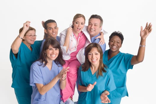 Group portrait of nurses carrying doctor