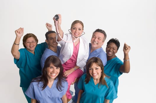 Group portrait of nurses carrying doctor