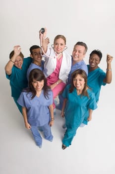 Group portrait of nurses carrying doctor